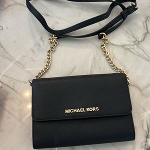 Michael Kors Crossbody bag black and gold no visible signs of wear and tear
